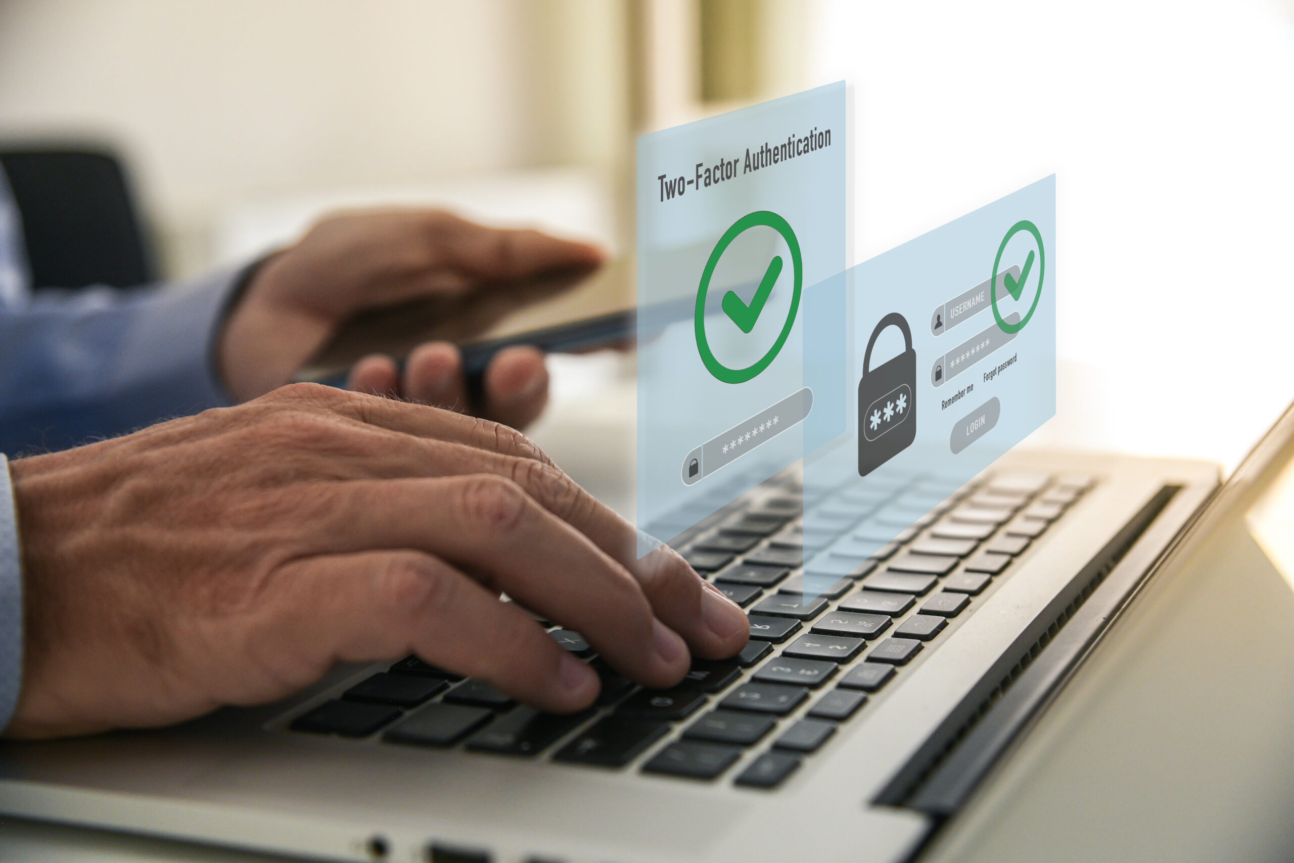 Fingers typing on a keyboard and symbols indicating two-factor authentication.