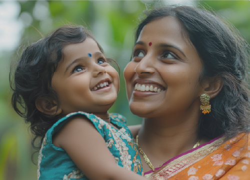 Mom holding her daughter in India to represent maternity leave benefit.